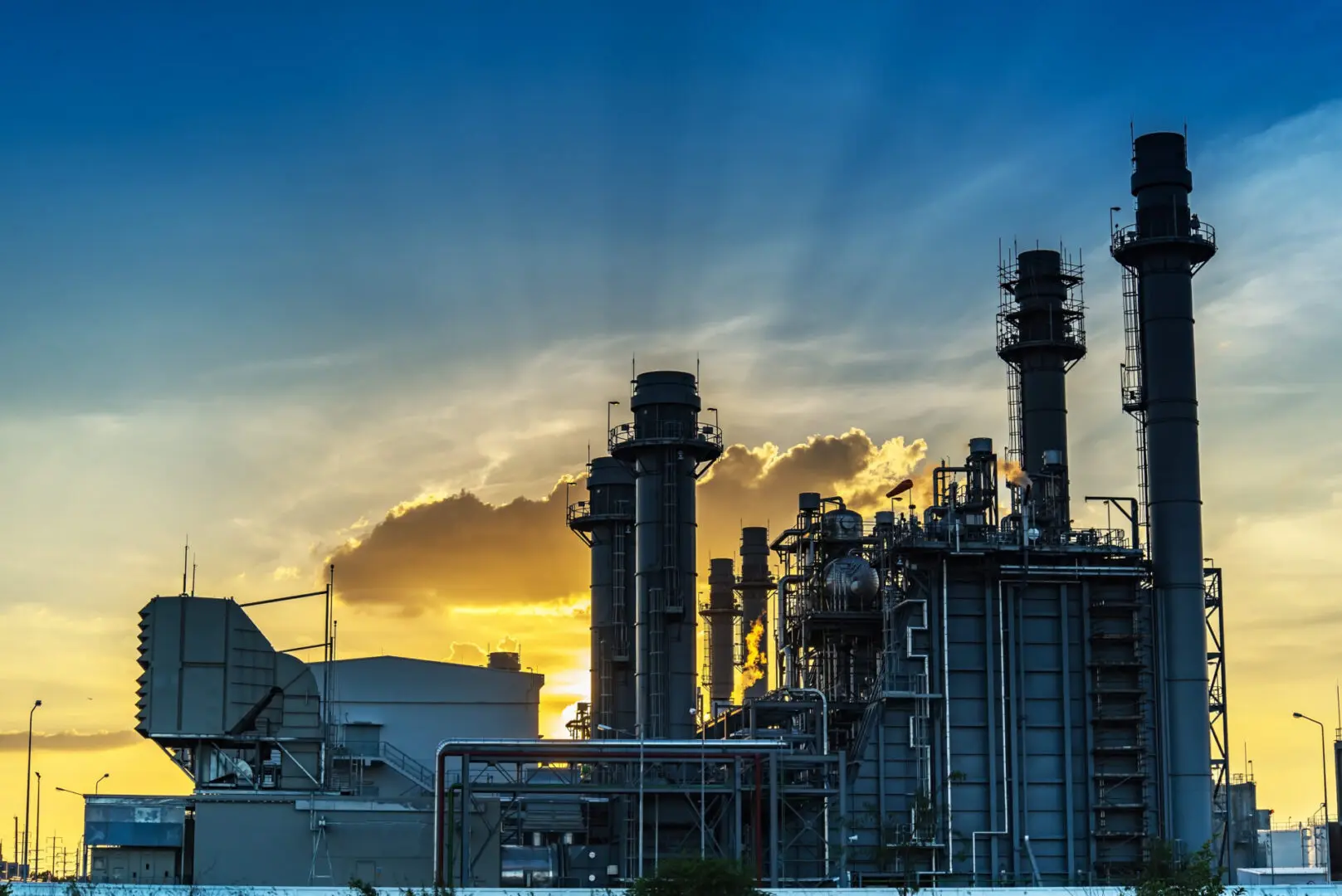 Gas,Turbine,Electrical,Power,Plant,At,Dusk,With,Orange,Sky